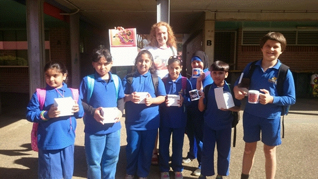 Seven of the 21 VAP 2014 winners from Hampden Park Public School in Lakemba NSW, with Elizabeth OBrien of The LEAD Group. L to R: Fatima Syed (aged 9), Zahra Naisa Lativa, Izzah Hussain, Raita Islam, Leyanna Flaifel, Abdur Rehman (all aged 8) and Leonard Carey (9).